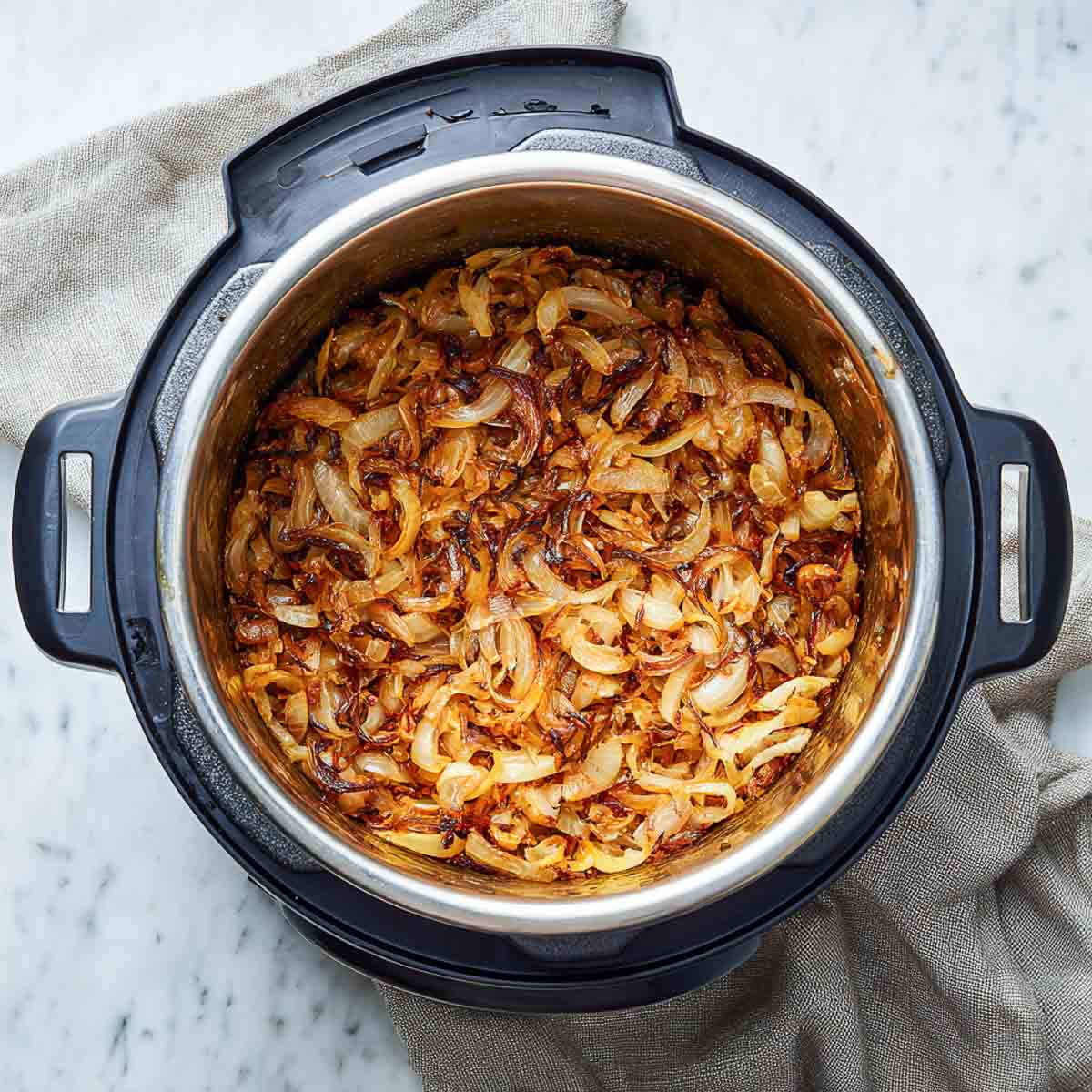 Thinly sliced onions sautéed until deeply golden inside the Instant Pot.