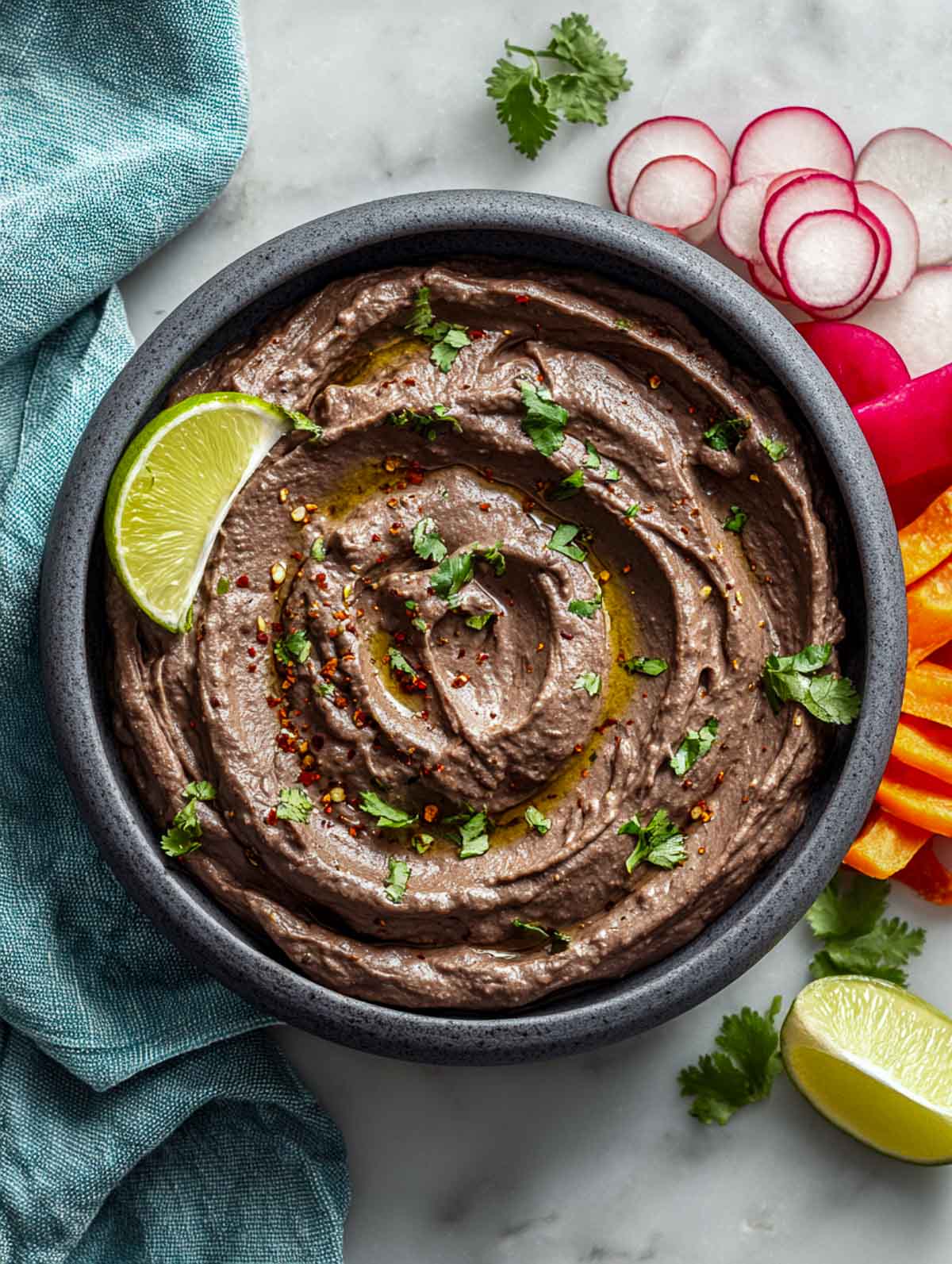 Spicy black bean dip with lime and cumin served with vegetables.
