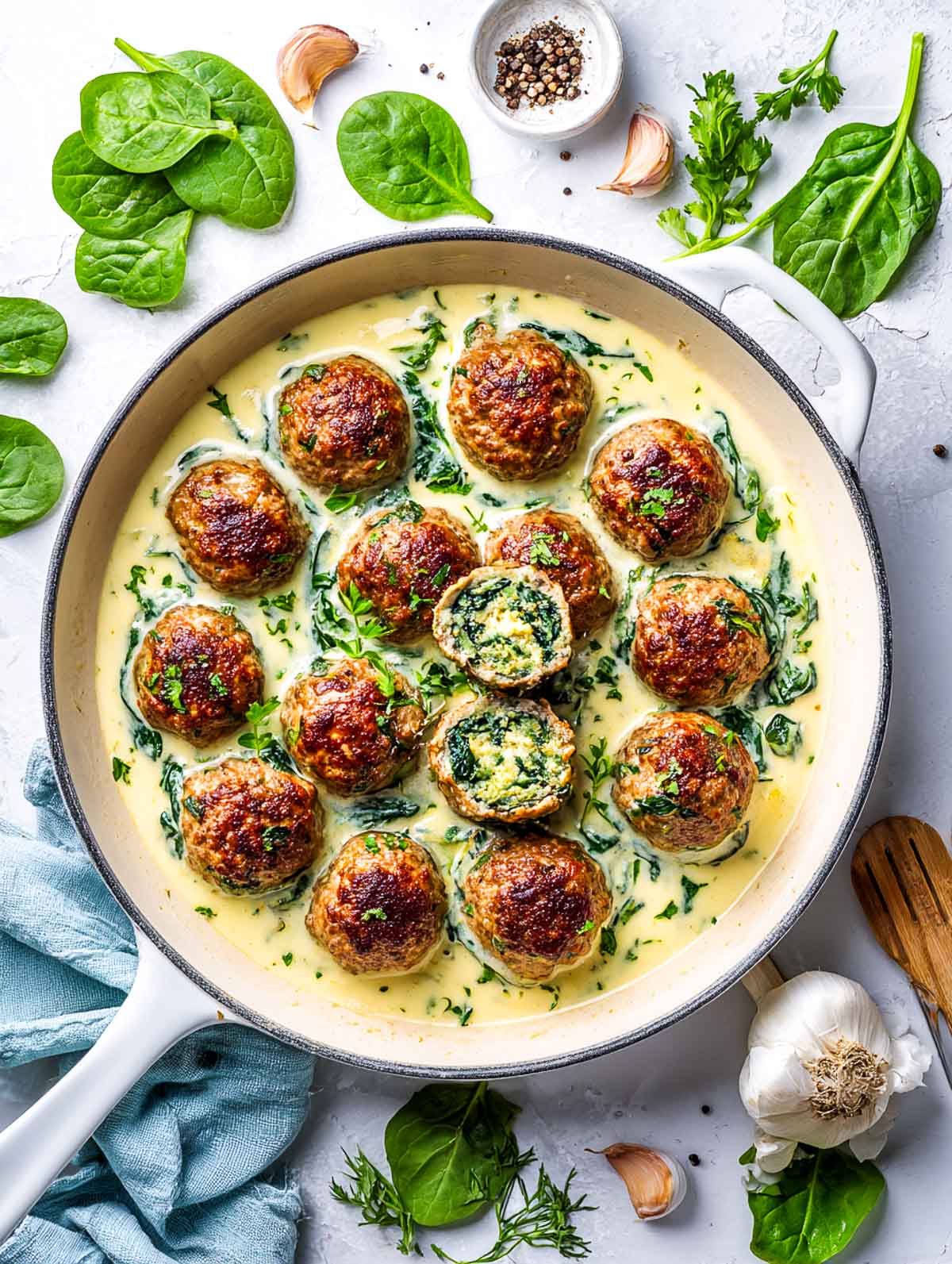 Herb and spinach stuffed meatballs simmered in a creamy garlic sauce.