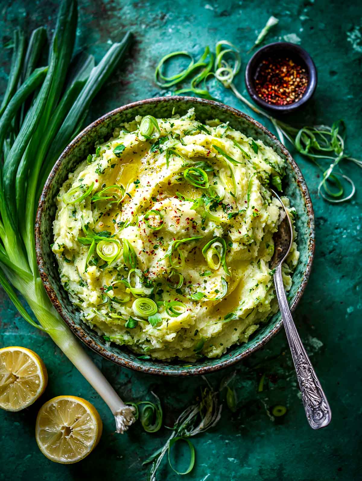 Creamy pesto mashed potatoes topped with buttery sautéed leeks.