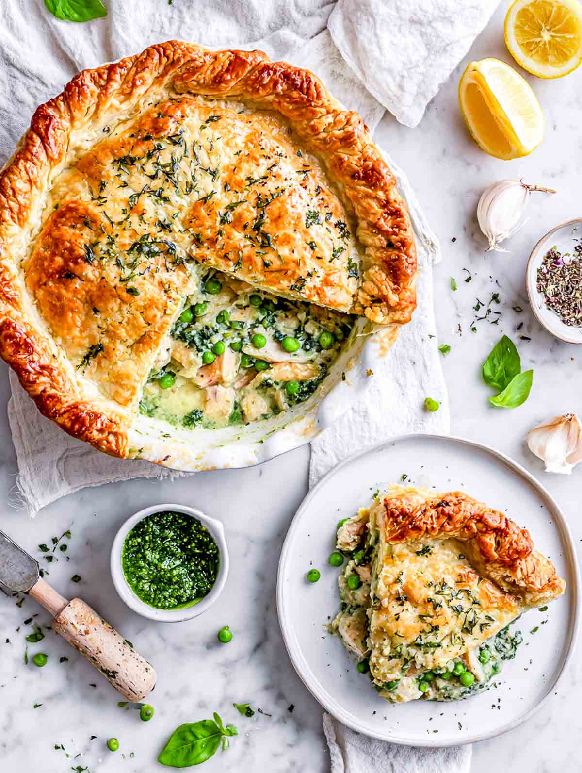 Spinach pesto chicken pot pie with flaky herb crust and creamy green filling.