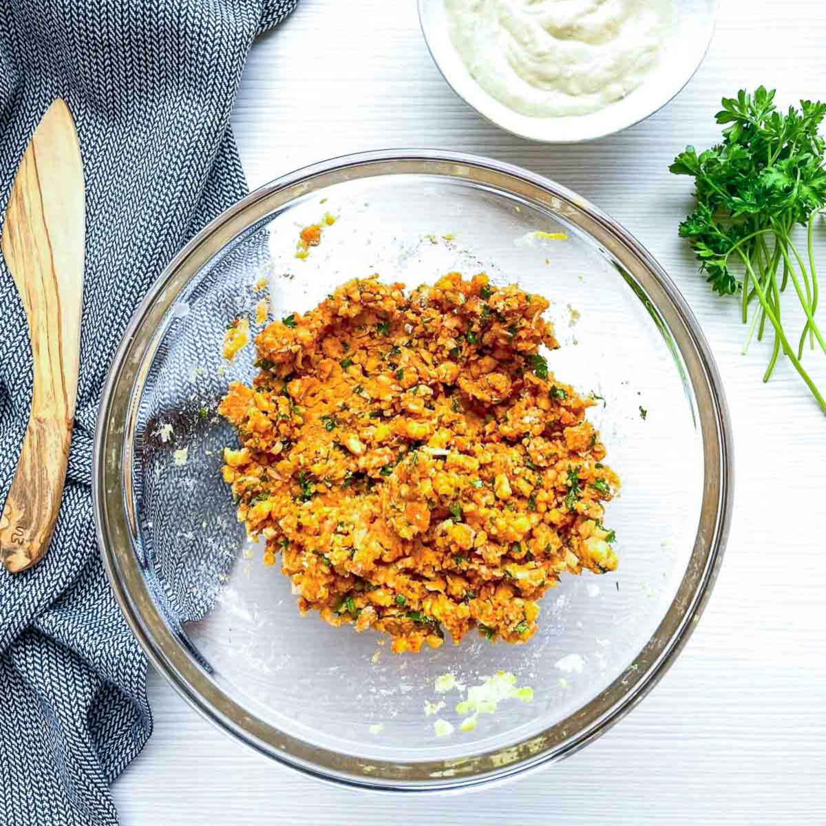Chickpea mixture in glass bowl for falafel