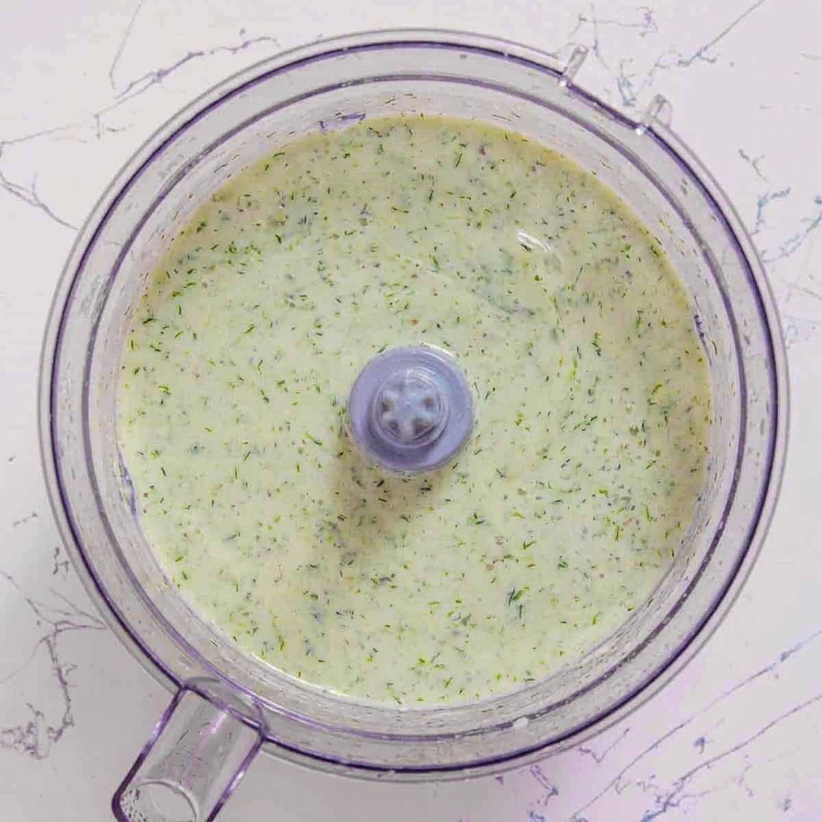 Kefir cucumber avocado soup blended until creamy and smooth in a food processor.