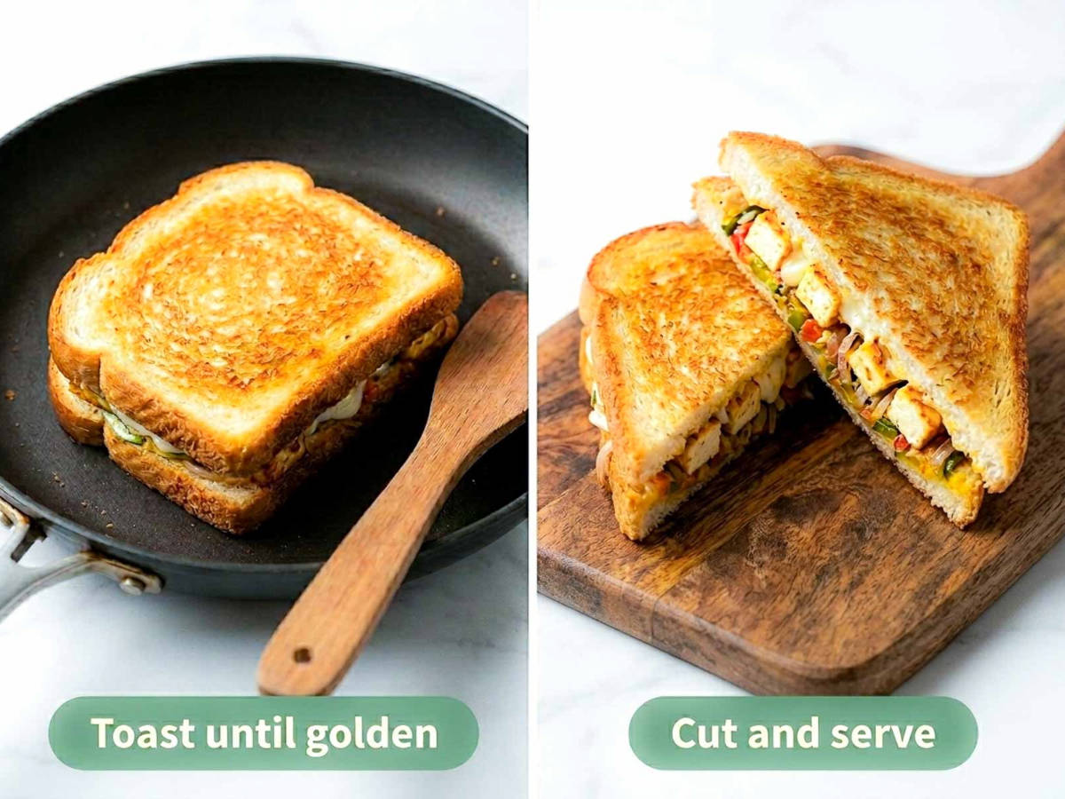 Paneer sandwich toasting golden in a skillet and cut in half on a wooden board.