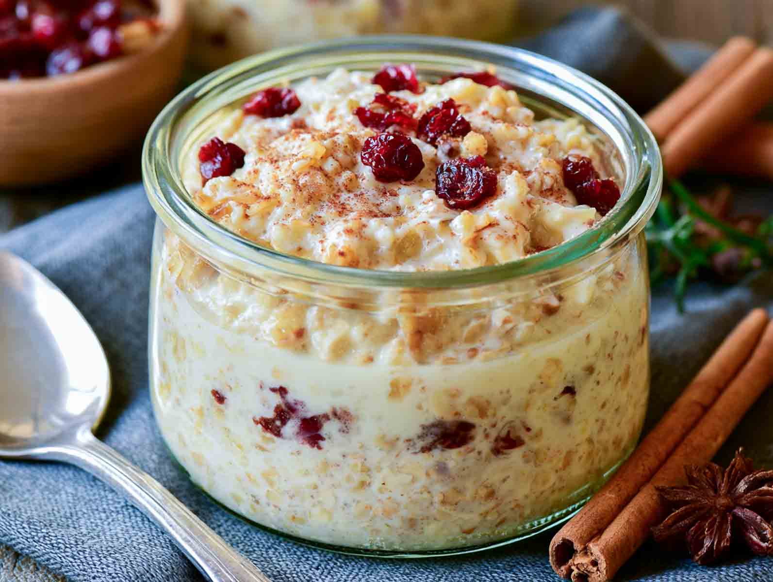 Eggnog kefir overnight oats topped with dried cranberries and a dusting of nutmeg and cinnamon.